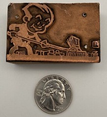 Vintage Printers Block Man Raking in Money Cartoon Graphic Copper